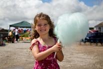 Kensa holds up her huge blue candy floss at Hayle Celebration Day 2016